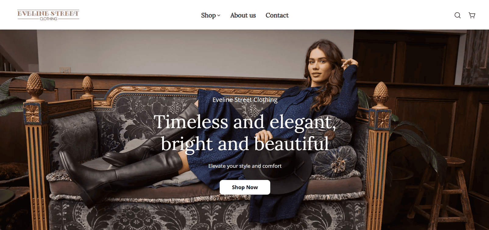 Black knee-high boots with block heels on a woman sitting on a luxurious vintage sofa.