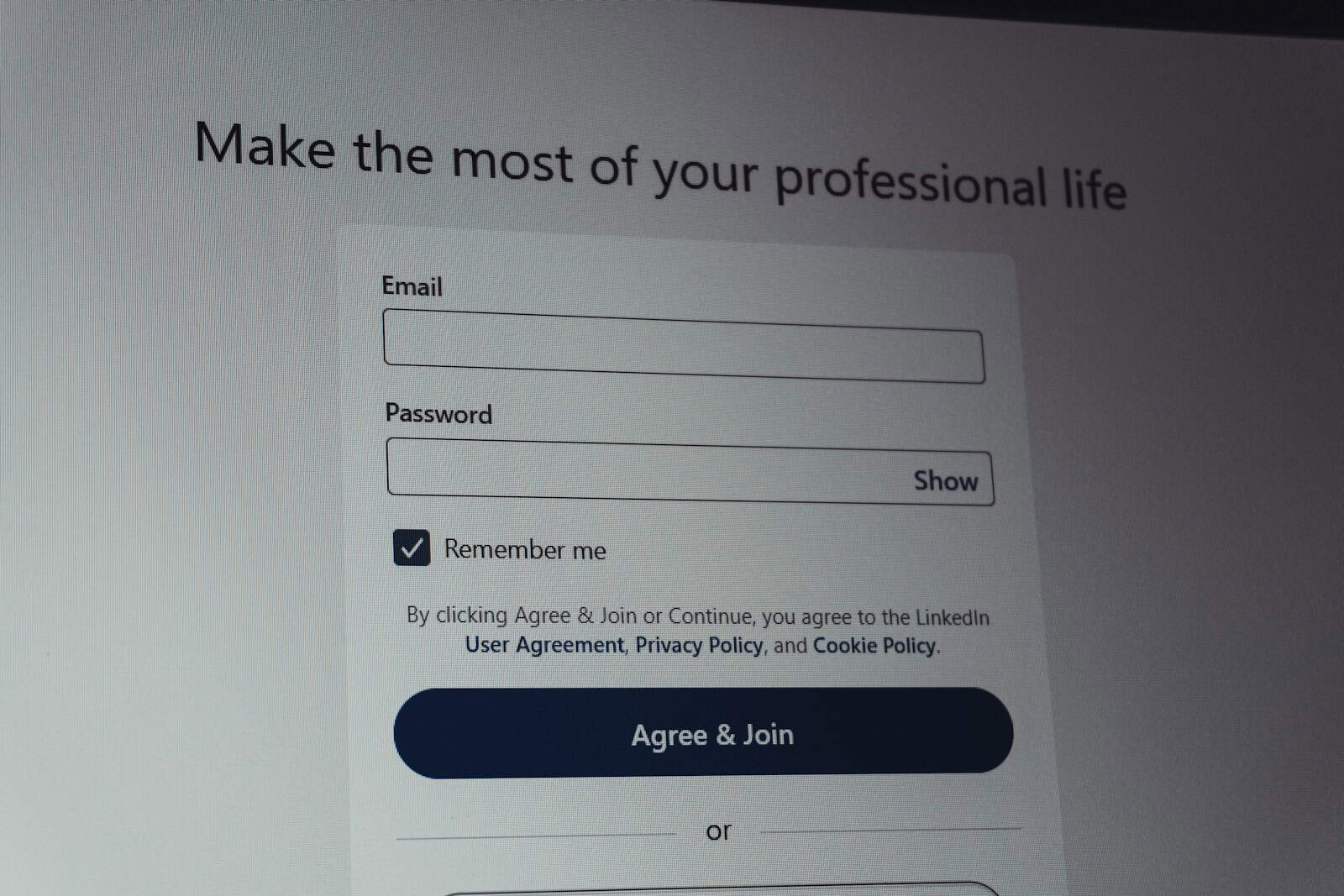 Linkedin login screen with email and password fields.